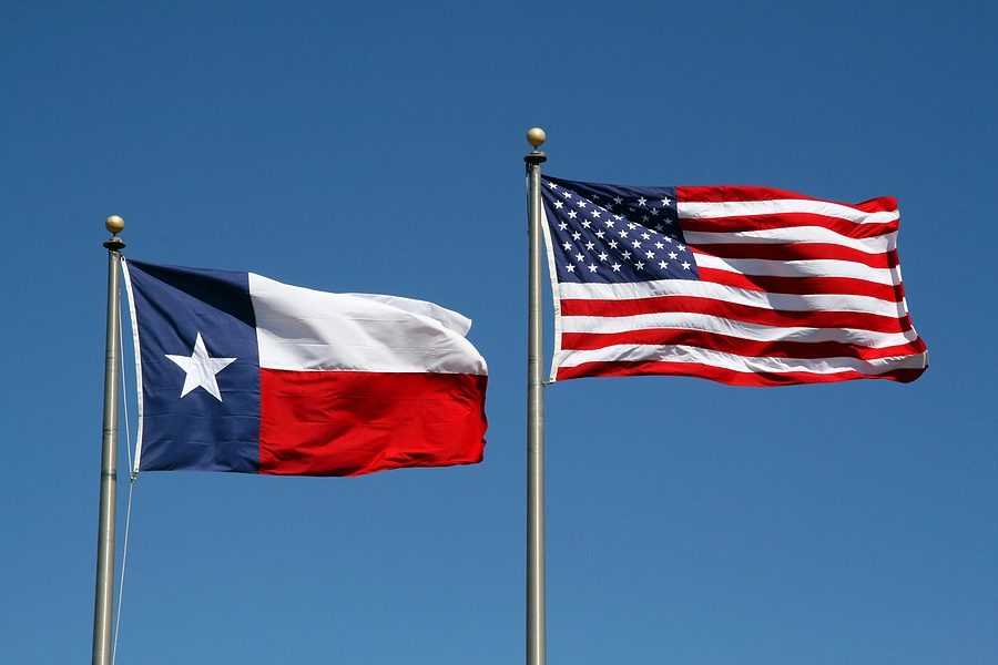 us flag and texas flag flying outside va regional office where a veteran can file an appeal for disability benefits