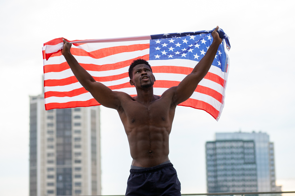 veteran with american flag - SMC Benefits for Veterans - Bartlett Legal Group